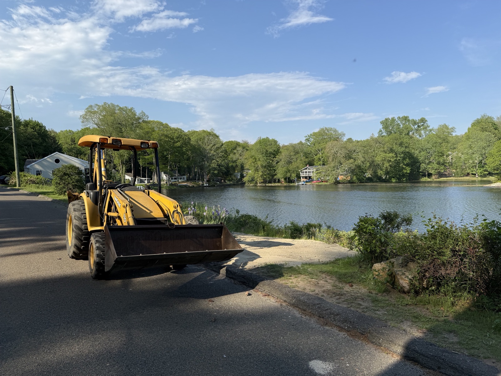 Backhoe loader parked at the Grass Island boat ramp in Guilford, CT