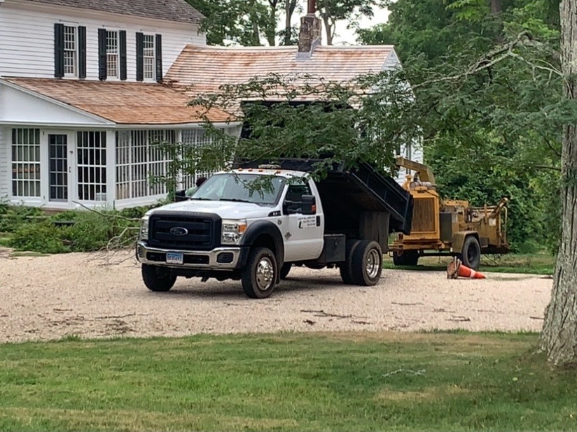 Country Hill crew doing tree work with a wood chipper at a historic Guilford home